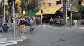 Pro-government demonstrants argue with anti-government demonstrants aside of a Police vehicle parked in front of Benjamin Netanyahu private house