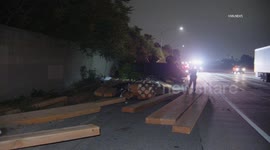US, Los Angeles: Arcadia Semi Crashes Through Sound Wall Off 210 Freeway Part 2