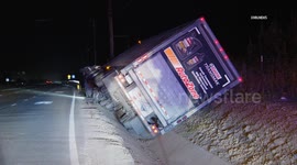 US, Los Angeles: Santa Paula Auto Zone Semi Lands in Ditch Off 126 Freeway
