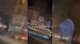 Iran: Protesters Cheer While Torching Iranian Leader's Billboard