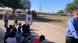Children watch the 68th annual PVTRA's Annual Trail Ride for the Houston Livestock Show
