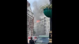 Flames seen from street as fire rips through flat in Westminster, London