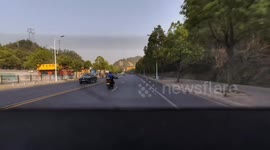 Dashcam captures head-on collision with car crossing lane in Hubei, China