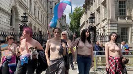Topless trans activists stage a protest outside Downing St in support of trans rights