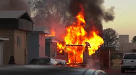 US, Phoenix: Phoenix Firefighters Battle Raging Mobile Home Fire