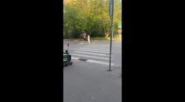 Yandex Rovers line up at roadside to cross pedestrian crossing in Moscow, Russia