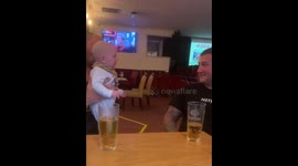 Baby adorably mimics uncle’s muscle pose and roar in Manorbier, Wales, UK