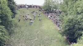 Dozens take part in world-famous annual cheese rolling competition