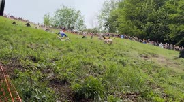 Hundreds Watch Cheese Rolling Event at Cooper's Hill, Gloucestershire
