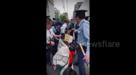 Japan: Japanese police forcibly remove peaceful protestors from a sit-in they staged outside the Israeli embassy in Tokyo