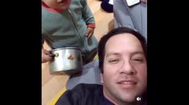 Toddler hits dad with metal pot, caught off guard in Santiago, Chile