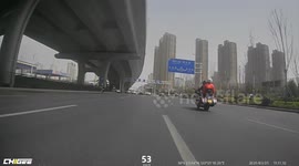 Loose wheel rolls along road in China