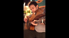 'Wicked Game' gets a harp guitar twist—Played one-handed on a double guitar