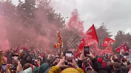 Liverpool fans celebrate 20th league title win as players and managers go past in bus parade