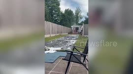 Dad crashes into table during slip and slide fail