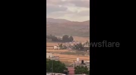 Israeli settlers deliberately block the road in front of a Palestinian ambulance in the south of Nablus, the West Bank