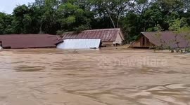 Floods wash away homes amid heavy rain in Indonesia