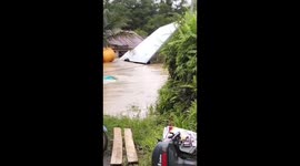 Homes swept away as flash floods surge through rural Indonesia