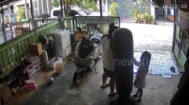 Mother accidentally knocks over daughter as they play with punchbag together
