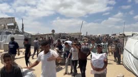 Palestinians return to Gaza aid center a day after dozens injured in Israeli shooting