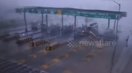 Toll booth roof blows away during storm in India