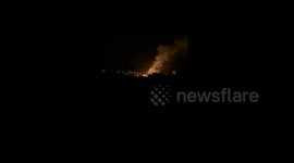 Fire erupts after Israeli forces bombed tents in the Al-Baraka area, south of Deir al-Balah