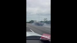 Crazed truck driver seen shunting car along road
