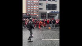 Young boy nutmegs security guard before being chased during Liverpool's trophy parade