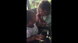 Little brother gives a whack as they play at home