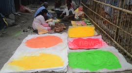 India: Women's who lives in Porajhar village makes and prepares colored powder known as Gulal