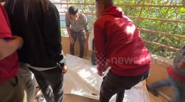 Relatives mourn Palestinians killed in Israeli strike on aid center in Gaza