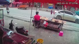 Motorcycle skids to skillfully avoid crashing into back of car
