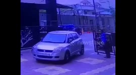 A car hit a guard, the guard standing behind was caught in the impact after the car collided with the gate in Gaziabad, Uttarpradesh