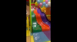 Man spins while sliding down and gives thumbs up in Canóvanas, Puerto Rico