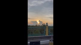 Cloud shaped like praying figure spotted during sunset in Siak Sri Indrapura, Indonesia