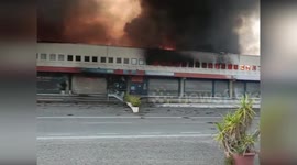 Fire crews tackle blaze at warehouse near Naples, Italy