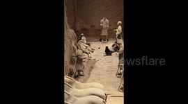 Shocking moment man jumps into terracotta army pit and pushes over ancient statues at World Heritage Site
