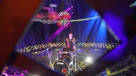 Drummer plays inside 'globe of death' as motorbikes zoom past his head at 40mph