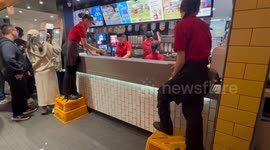 McDonald’s staff stand on stools to shout out order numbers in Sydney, Australia