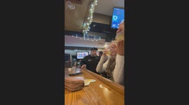 Drunken dive bar chaos when man grabs phone, drops unforgettable one-liner