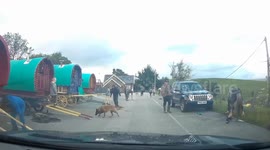 A group with horse-drawn caravans stoping off on the way to Appleby Horse Fair annual gathering of Gypsies