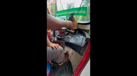 Toddler joins dad driving tuktuk around Phnom Penh