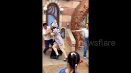 Chaos at Shanghai Disneyland as couple brawls with family of three after accidental photobomb