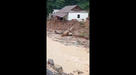 Flash floods cause landslides that destroy many houses in north central Vietnam