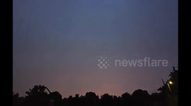 US: Lightning flashes across the night sky during a storm in Scott County