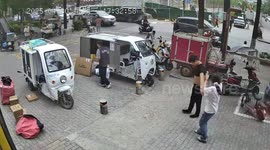 Strong wind knocks down tree and signage as people flee in Xi'an, China