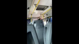 Cat calmly sits on man's head inside a bus in Buenos Aires, Argentina