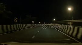 Motorcycle rider going the wrong way almost crashes into car