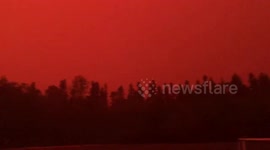 Raging wildfires turns sky eerie orange tinge in Canada's Manitoba