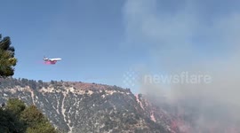 Planes negotiate steep terrain to dump retardant on Frazier Fire in California